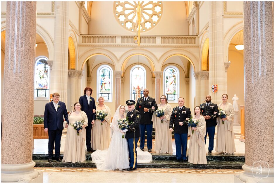 Military Saint Vincent wedding party portrait at the alter area in the winter 