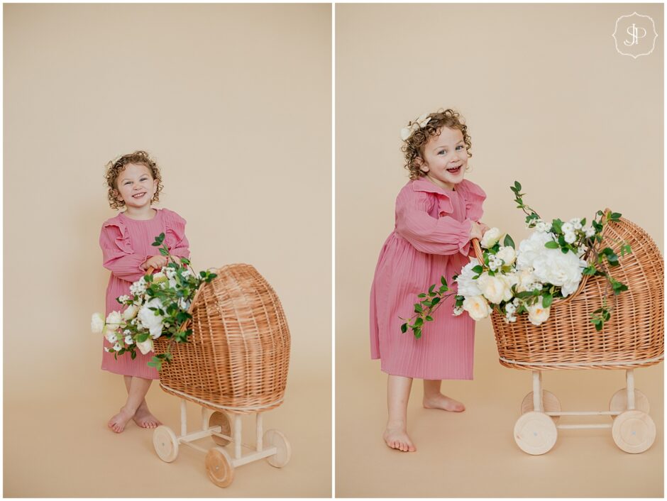 Latrobe photography studio spring 3rd birthday portraits with a flower decorate doll stroller 