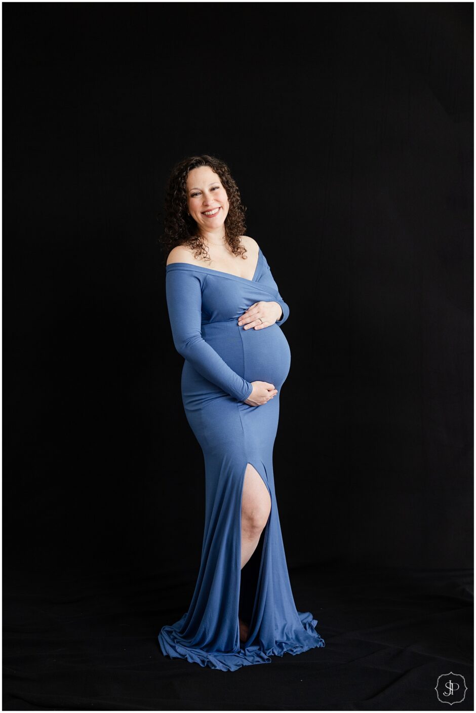 traditional maternity Studio Family Portrait Session with a black backdrop