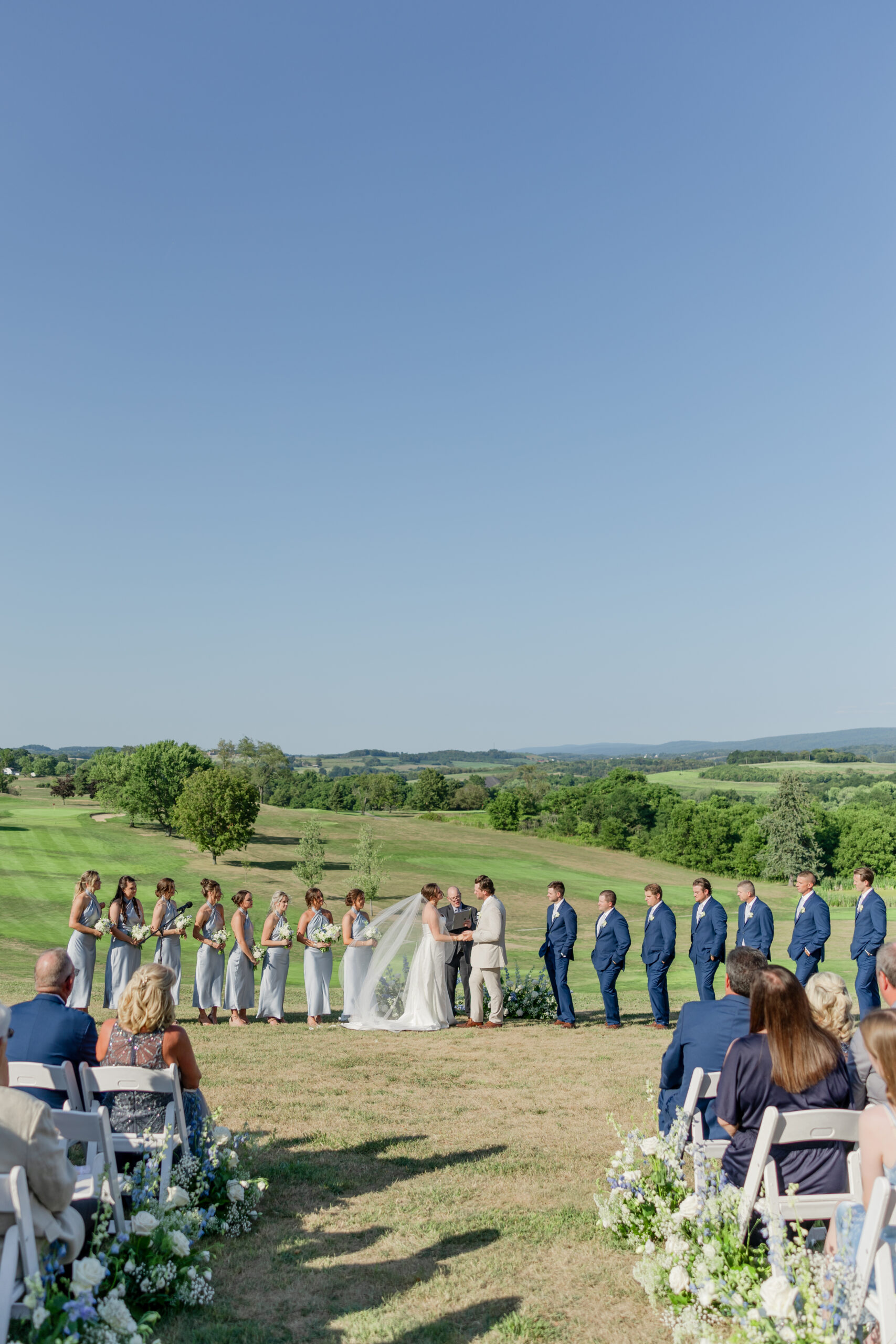 Experience Michaela & Luke’s breathtaking backyard wedding in Norvelt, Pennsylvania. From a scenic outdoor ceremony to an elegant tented reception, this rustic-chic celebration was unforgettable.